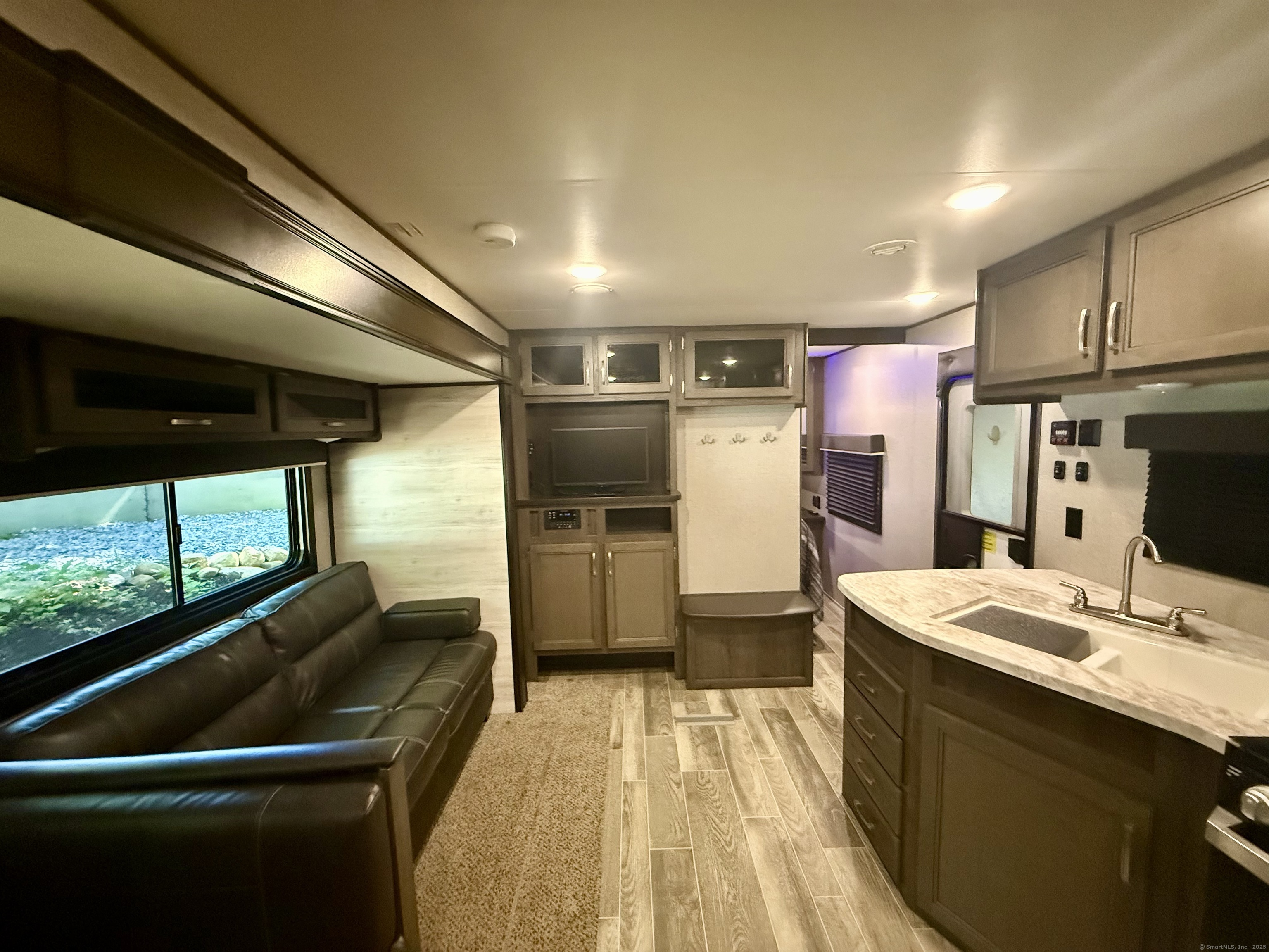 8 S Road, Unit R80 Stafford, CT 06076 - Photo 23 of 36 a kitchen with refrigerator and window