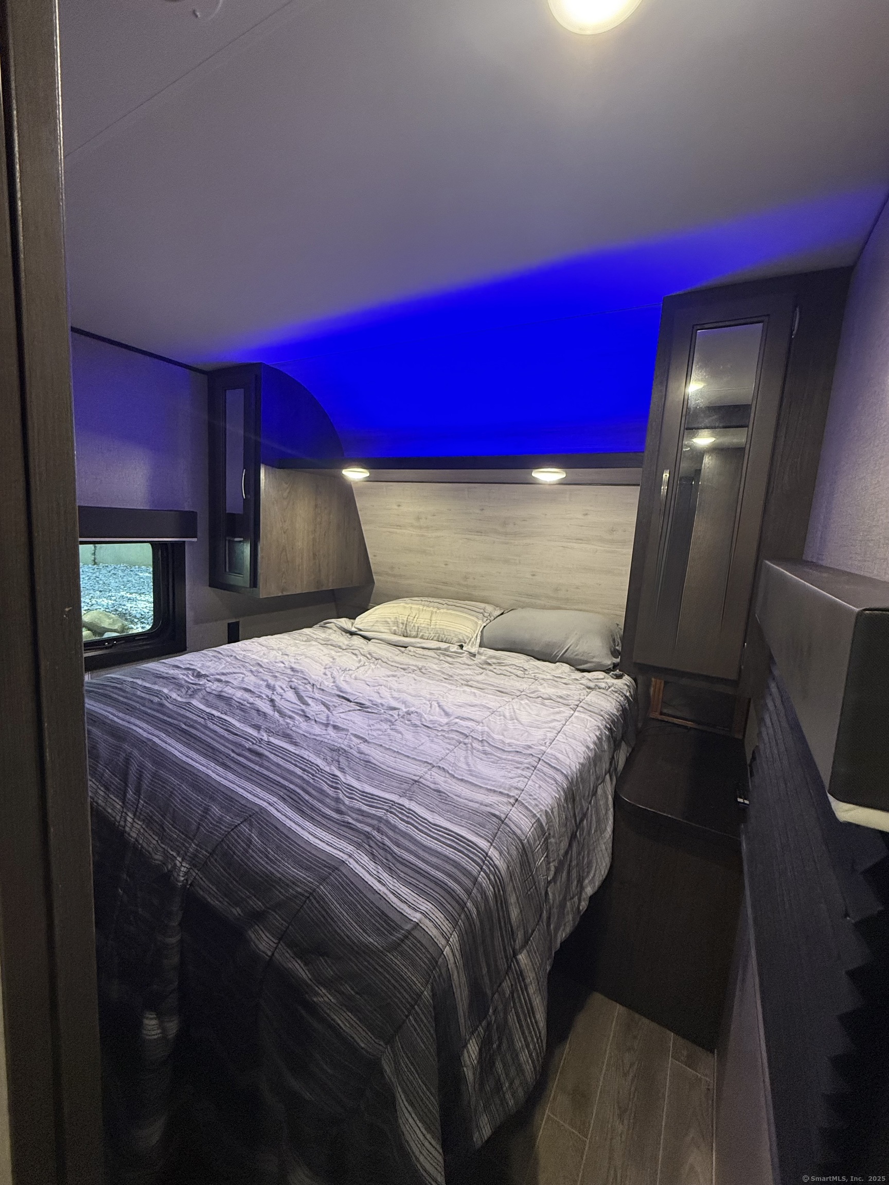 8 S Road, Unit R80 Stafford, CT 06076 - Photo 24 of 36 a bedroom with a bed and a mirror