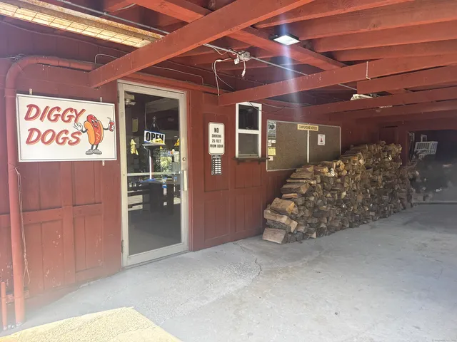 a room with pool table and windows