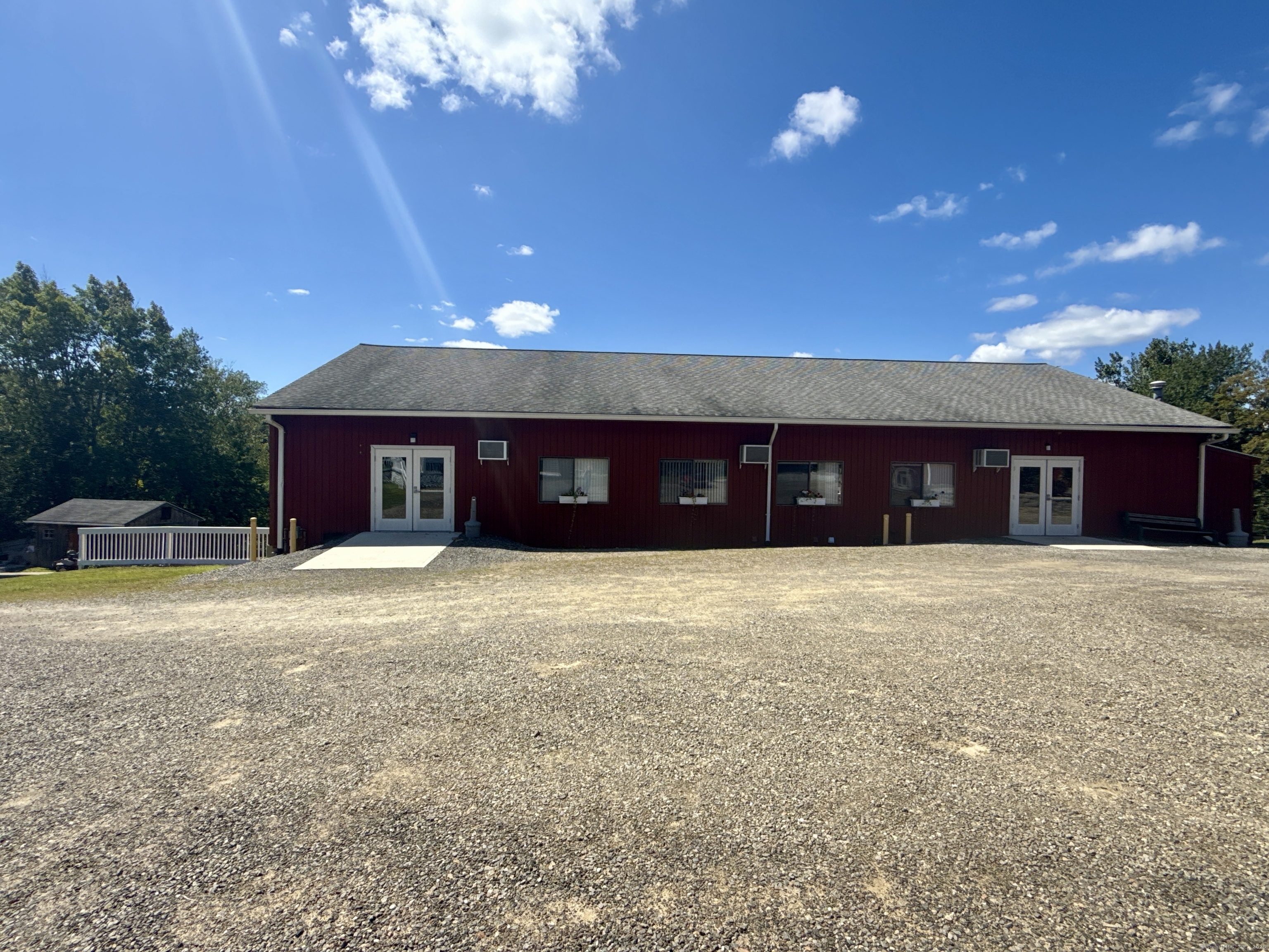 8 S Road, Unit R80 Stafford, CT 06076 - Photo 35 of 36 a view of a house with a yard and a large tree