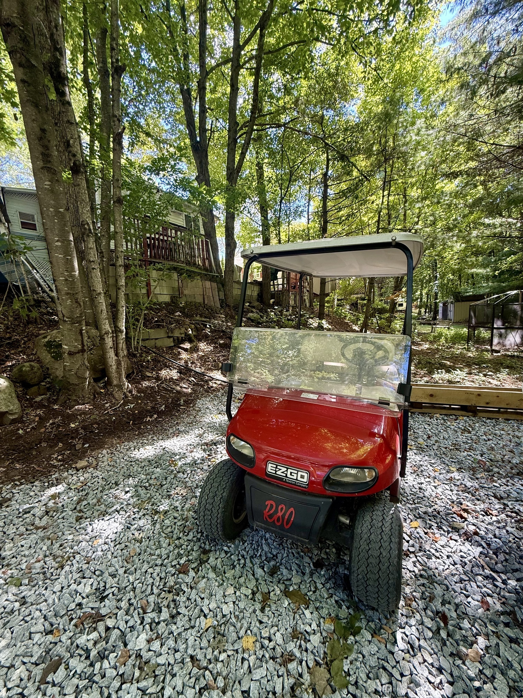8 S Road, Unit R80 Stafford, CT 06076 - Photo 4 of 36 a view of a backyard with table and chairs and a barbeque