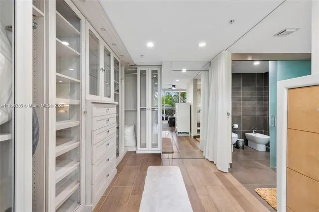 a view of a bathroom with a tub and shower