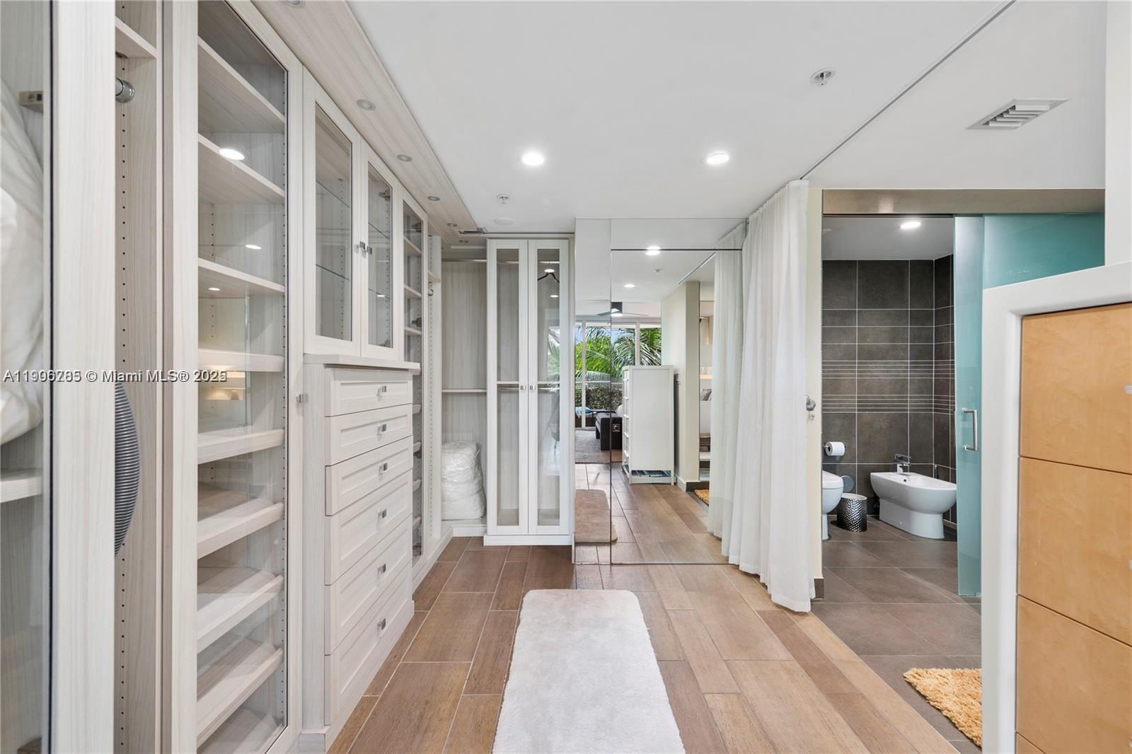 2155 Washington Court, Unit 309 Miami Beach, FL 33139 - Photo 12 of 23 a view of a bathroom with a tub and shower