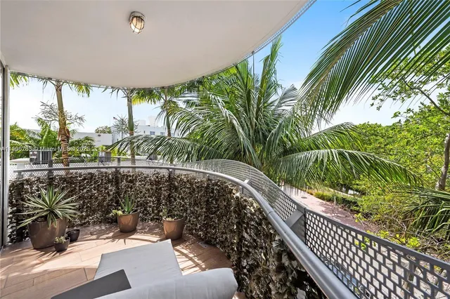 a view of balcony with furniture