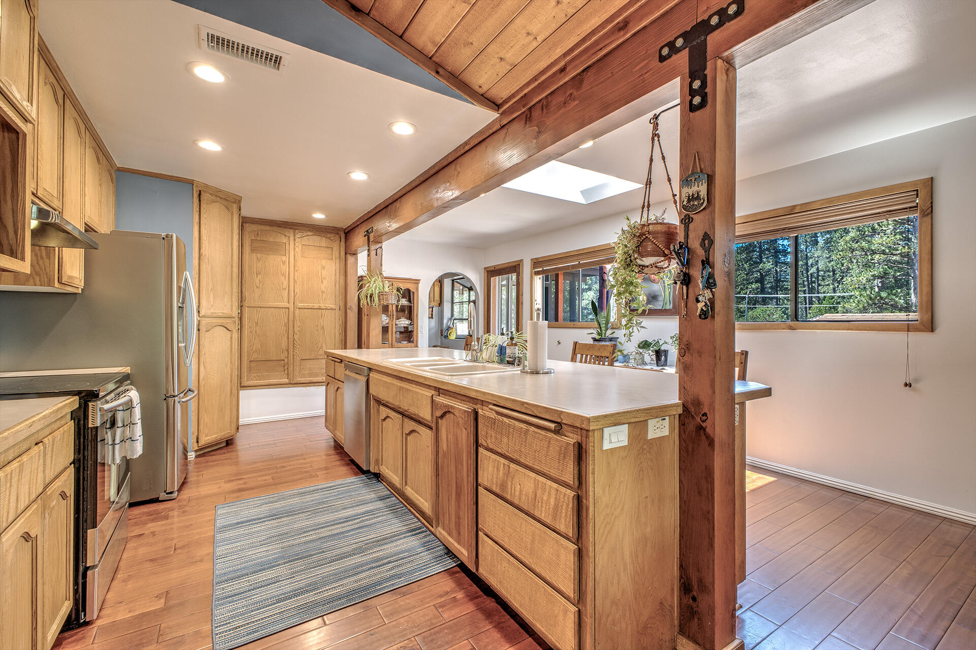 53394 Tollgate Road Idyllwild, CA 92549 - Photo 25 of 53 a large kitchen with stainless steel appliances granite countertop a large counter top a stove and a refrigerator