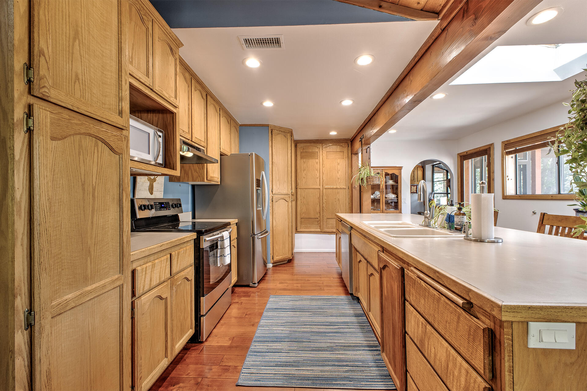 53394 Tollgate Road Idyllwild, CA 92549 - Photo 26 of 53 a kitchen with stainless steel appliances granite countertop lots of counter space and wooden floors
