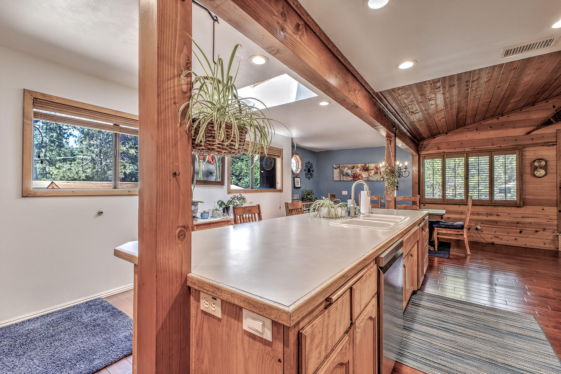 53394 Tollgate Road Idyllwild, CA 92549 - Photo 28 of 53 a kitchen with stainless steel appliances granite countertop a table chairs and a refrigerator