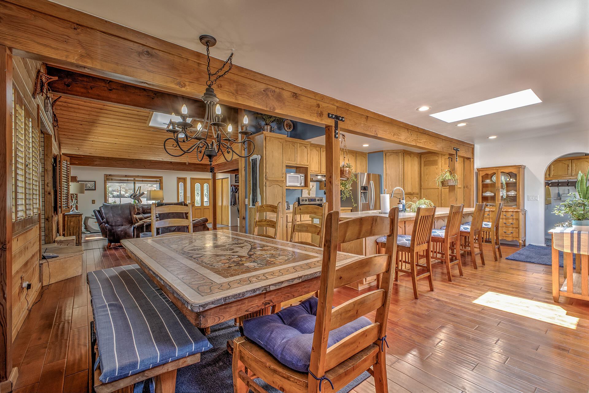 53394 Tollgate Road Idyllwild, CA 92549 - Photo 3 of 53 a view of a dining room with furniture wooden floor and chandelier