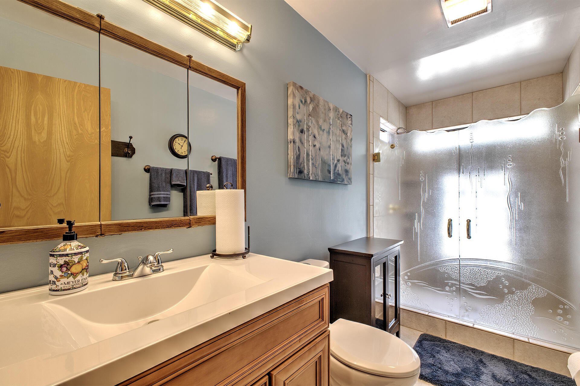 53394 Tollgate Road Idyllwild, CA 92549 - Photo 36 of 53 a bathroom with a granite countertop sink mirror vanity and toilet