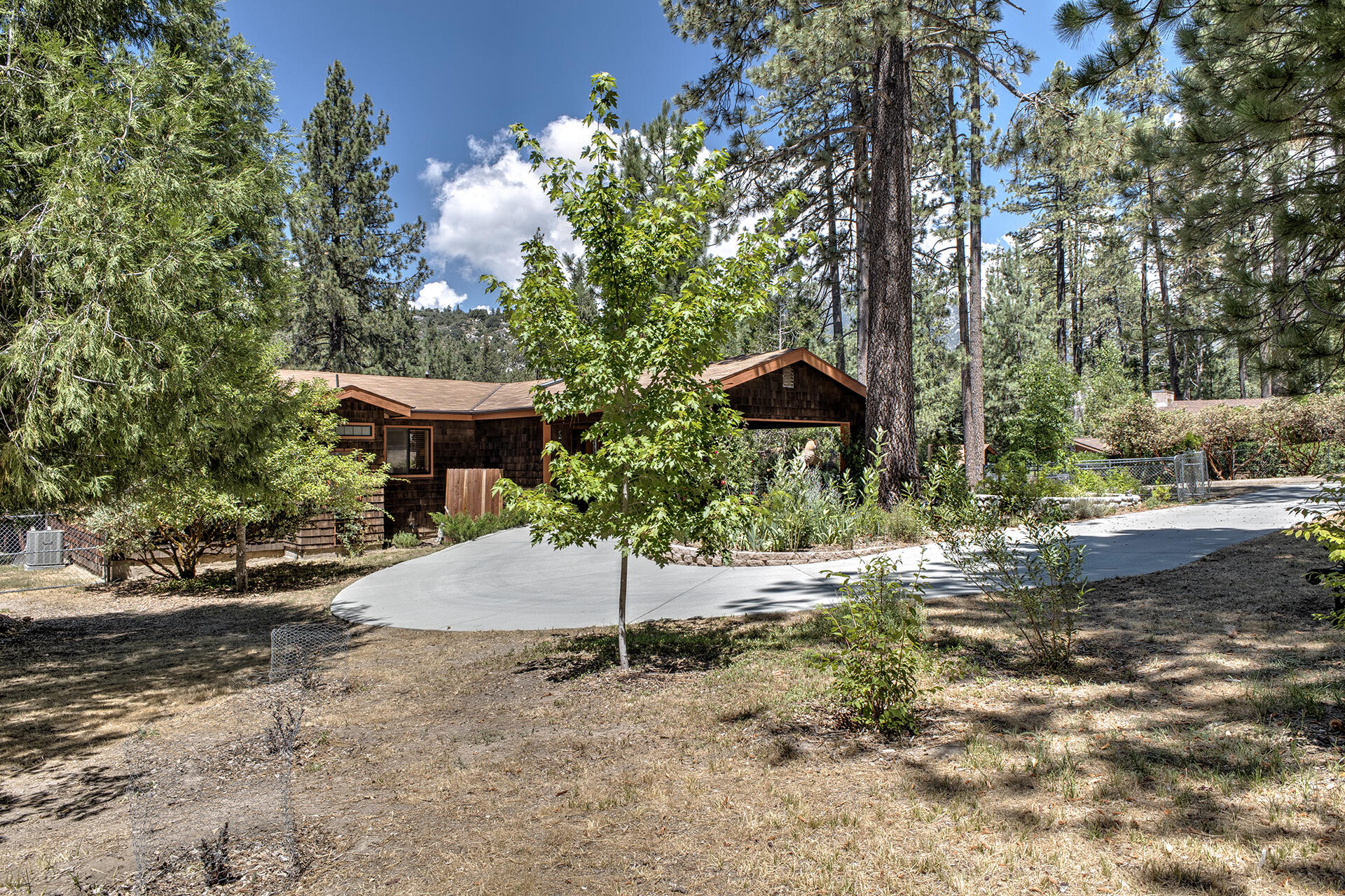 53394 Tollgate Road Idyllwild, CA 92549 - Photo 8 of 53 a backyard of a house with table and chairs
