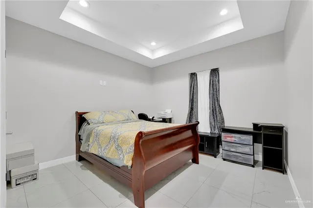 a bed room with a bed and a desk