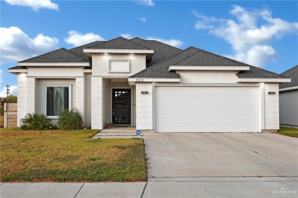 522 La Pointe Avenue Alton, TX 78573 - Photo 2 of 25 a front view of a house with a yard