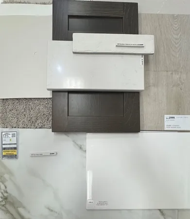 a kitchen with a refrigerator and a stove