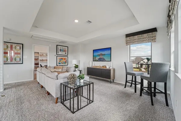 a living room with furniture and a table