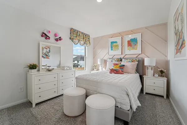 a bedroom with a bed and a bookshelf