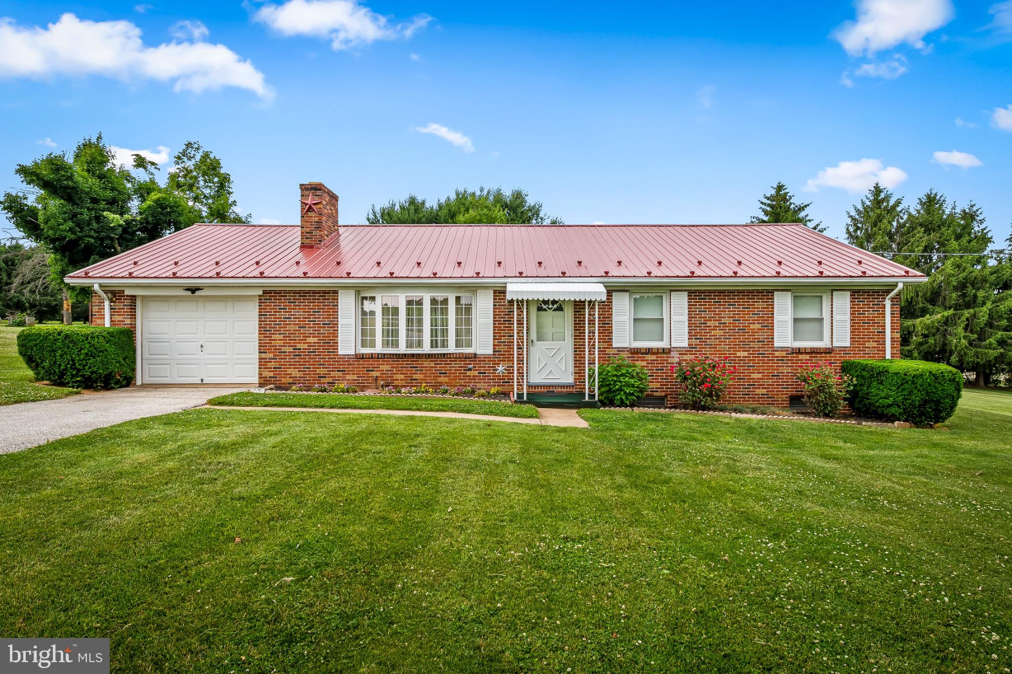 2100 Peterman Road Freeland, MD 21053 - Photo 3 of 36 Charming brick home with lush greenery.