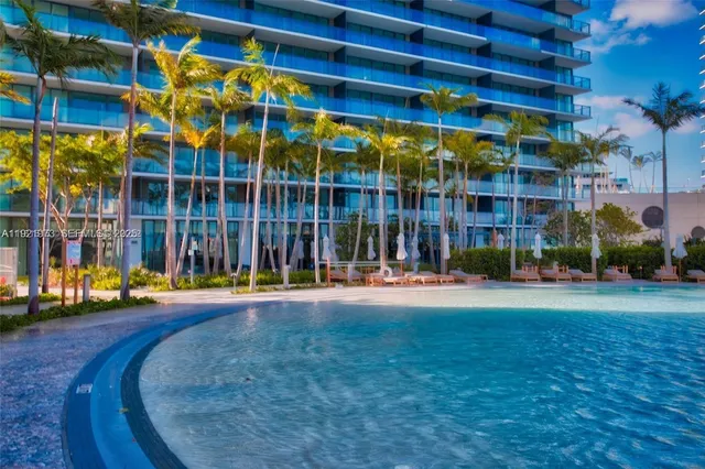 a view of a building with a backyard