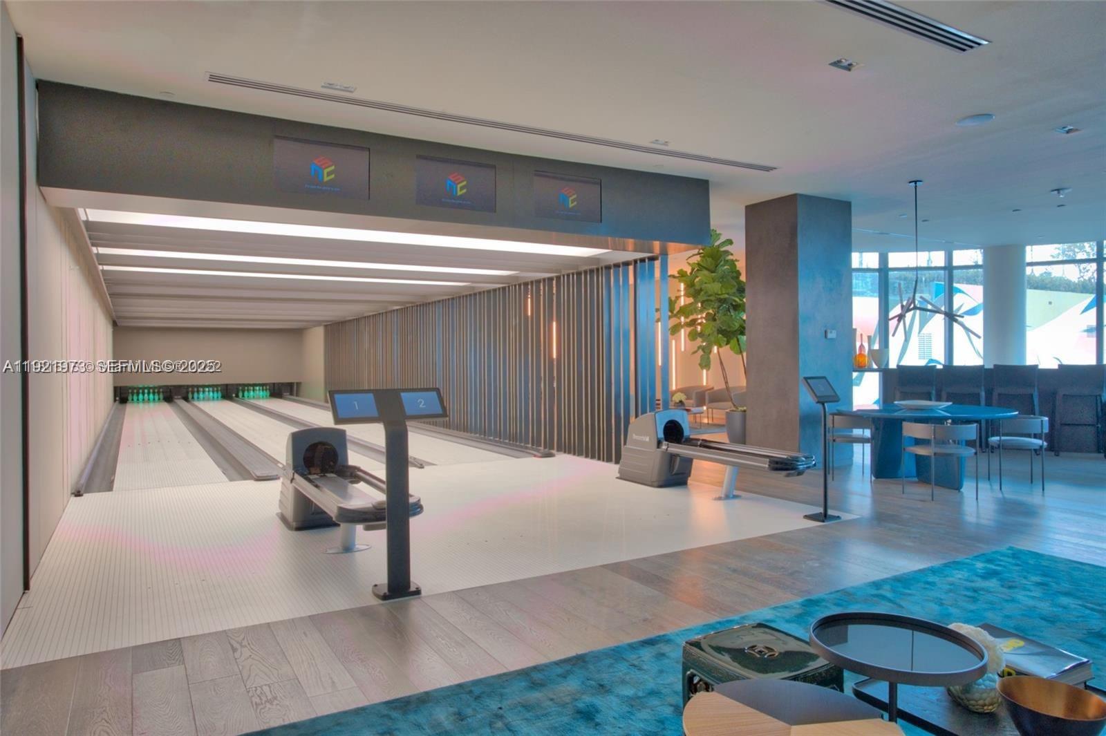 480 Northeast 31st Street, Unit 804 Miami, FL 33137 - Photo 16 of 39 a living room with furniture and a table