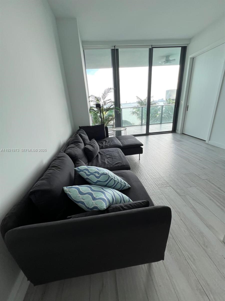 480 Northeast 31st Street, Unit 804 Miami, FL 33137 - Photo 26 of 39 a living room with furniture and a large window