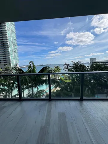 a view of outdoor space with wooden floor