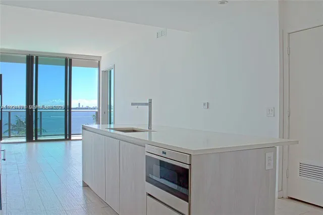 a kitchen with stainless steel appliances a stove and a refrigerator
