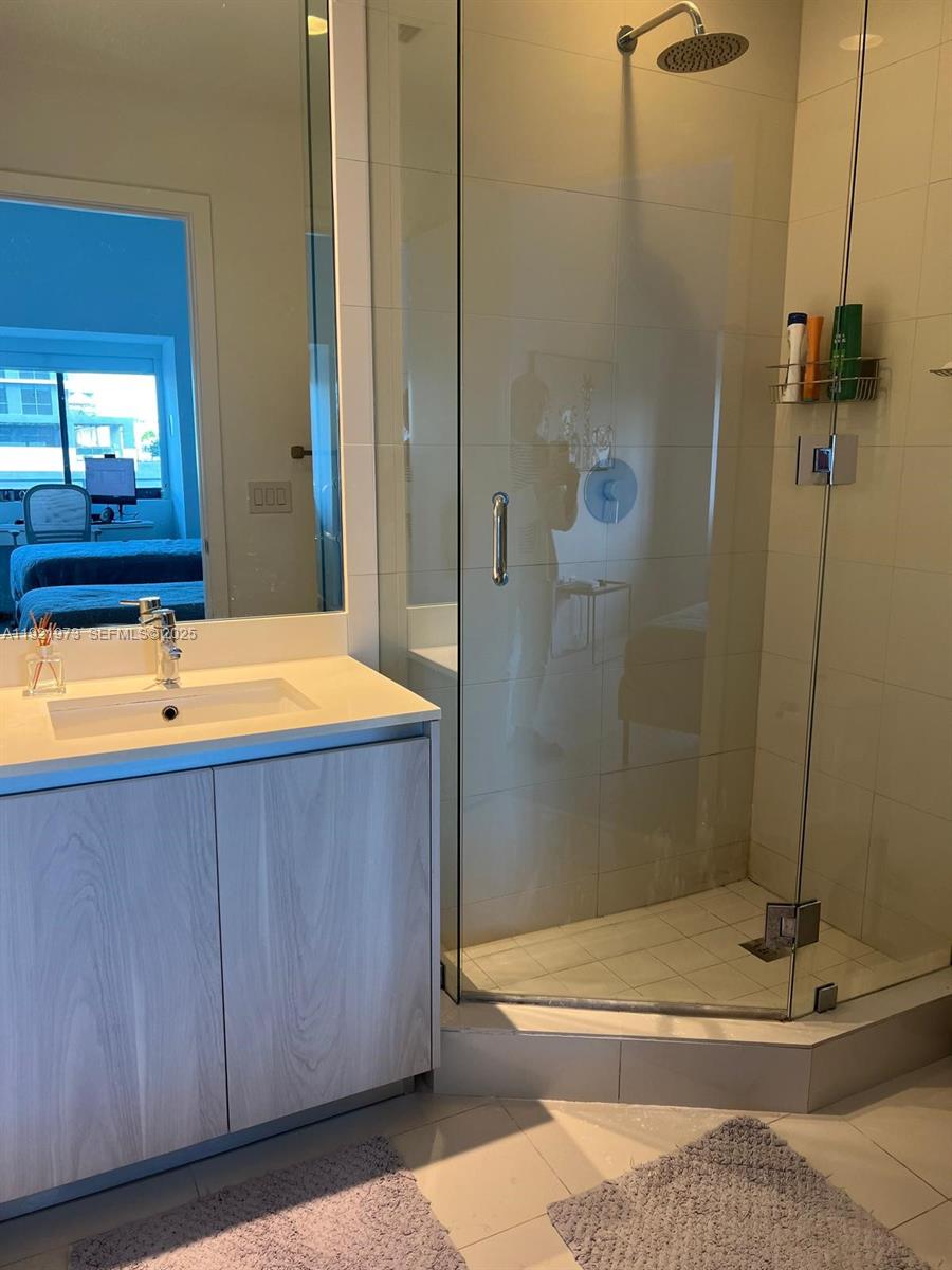 480 Northeast 31st Street, Unit 804 Miami, FL 33137 - Photo 32 of 39 a bathroom with a sink and shower