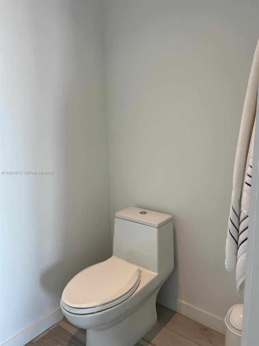 480 Northeast 31st Street, Unit 804 Miami, FL 33137 - Photo 38 of 39 a white toilet sitting next to a shower