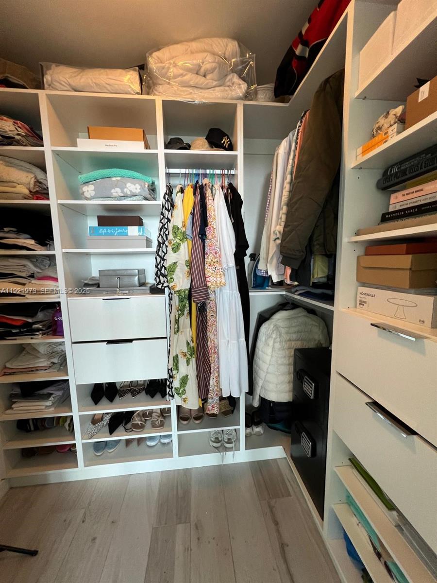 480 Northeast 31st Street, Unit 804 Miami, FL 33137 - Photo 39 of 39 a view of walk in closet with clothes and shoes