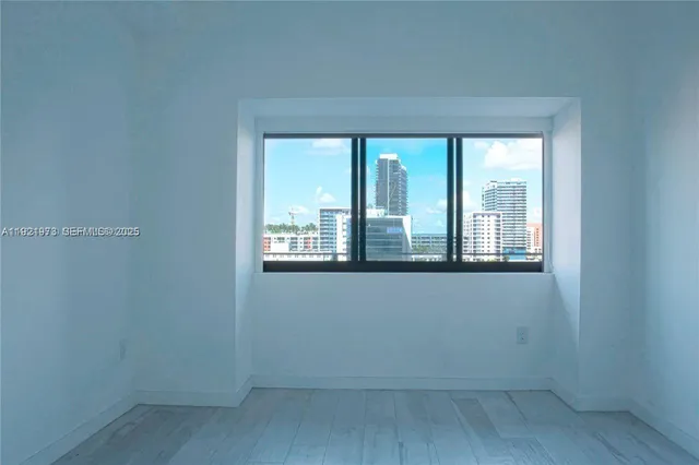 a view of an empty room with a window
