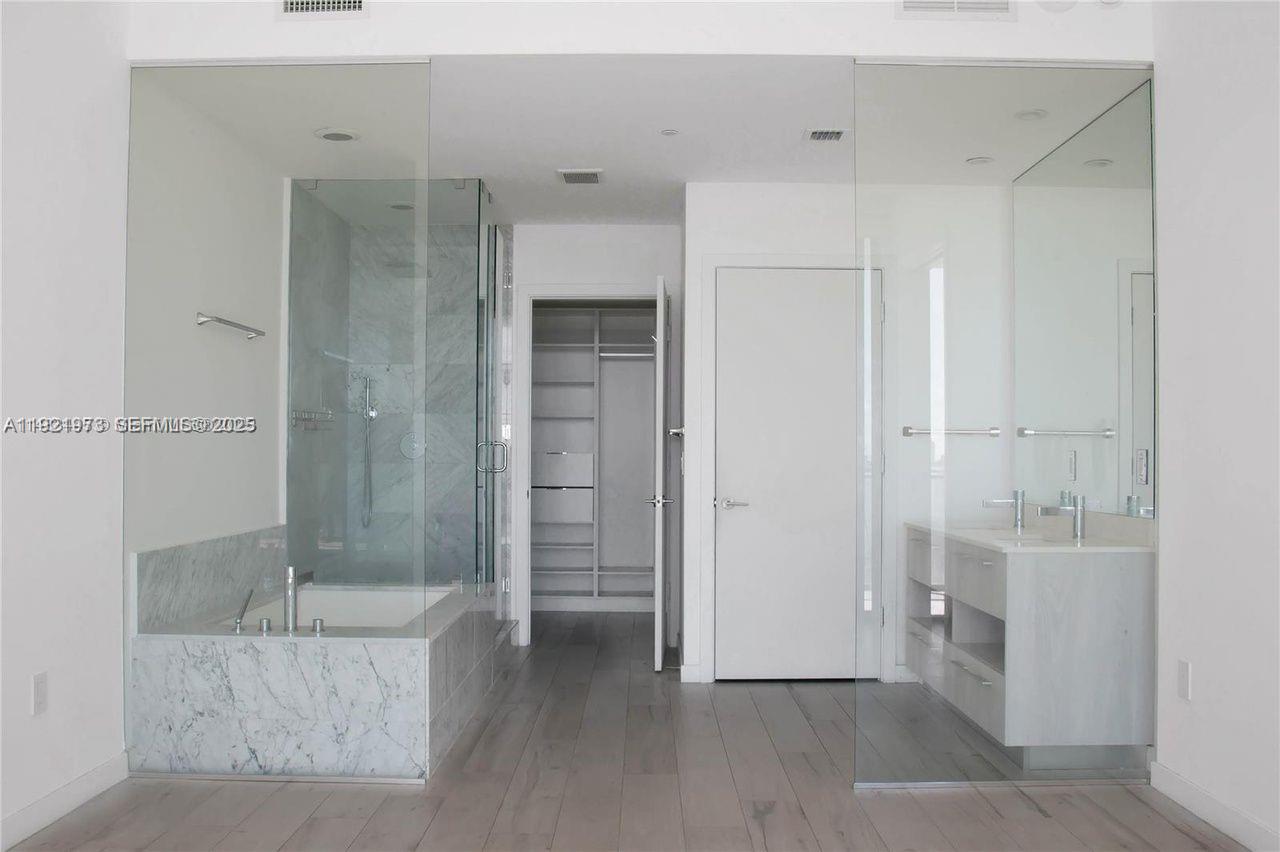 480 Northeast 31st Street, Unit 804 Miami, FL 33137 - Photo 8 of 39 a bathroom with a shower and a glass door