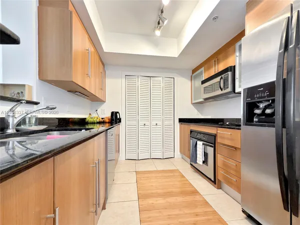 a living room with furniture or wooden floor and a large window