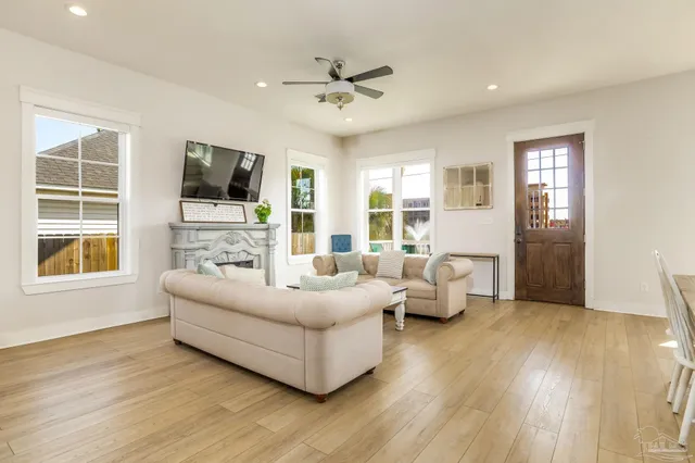 a living room with furniture and a flat screen tv