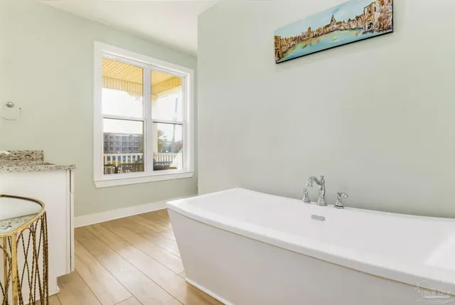 a bathroom with a bathtub and a sink