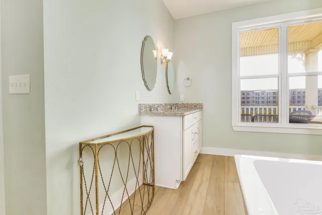 a spacious bathroom with a bathtub and a shower