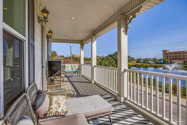 a view of a patio with a table and chairs