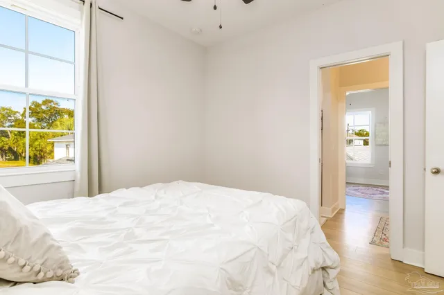 a large white bed in a white room