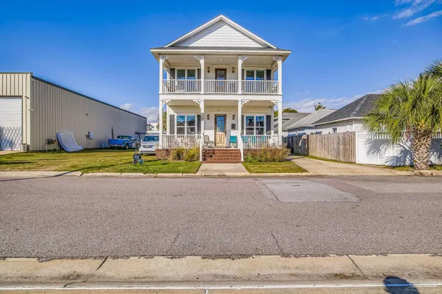 a front view of a house with a swimming pool