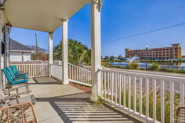 a view of a balcony with wooden floor