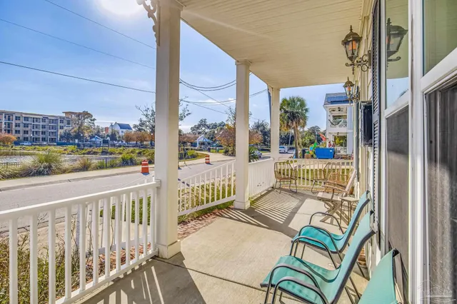 a view of a balcony with wooden floor