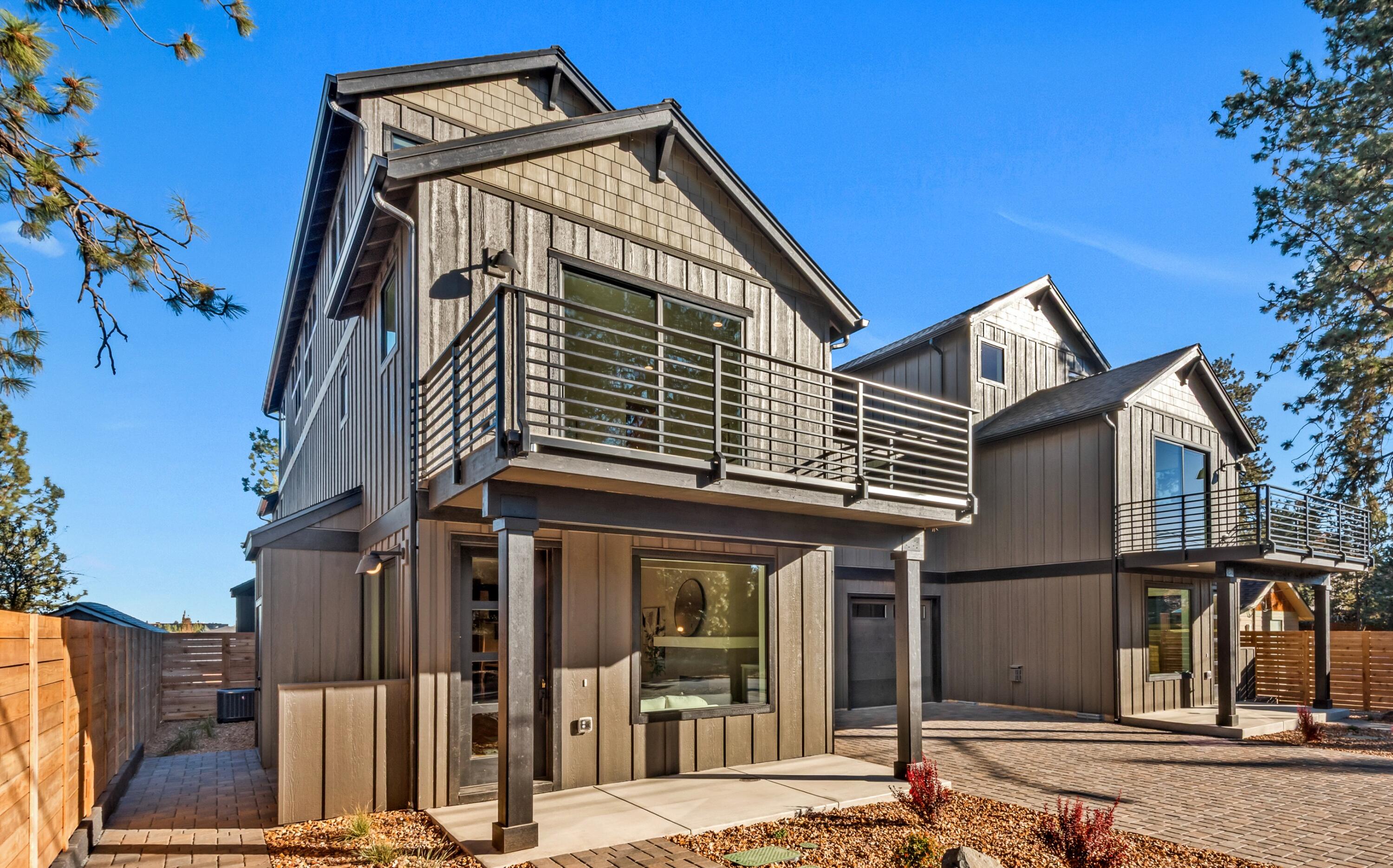 334 Southwest Roosevelt Avenue, Unit 4 Bend, OR 97702 - Photo 2 of 22 front view of a house with a street