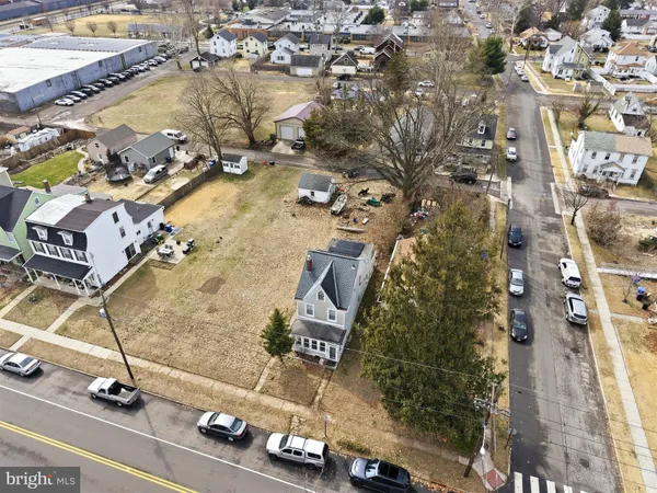 an aerial view of residential house with parking