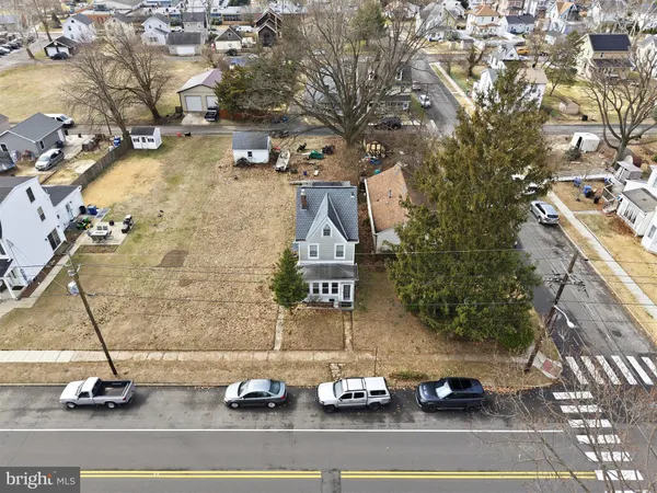 an aerial view of house with yard