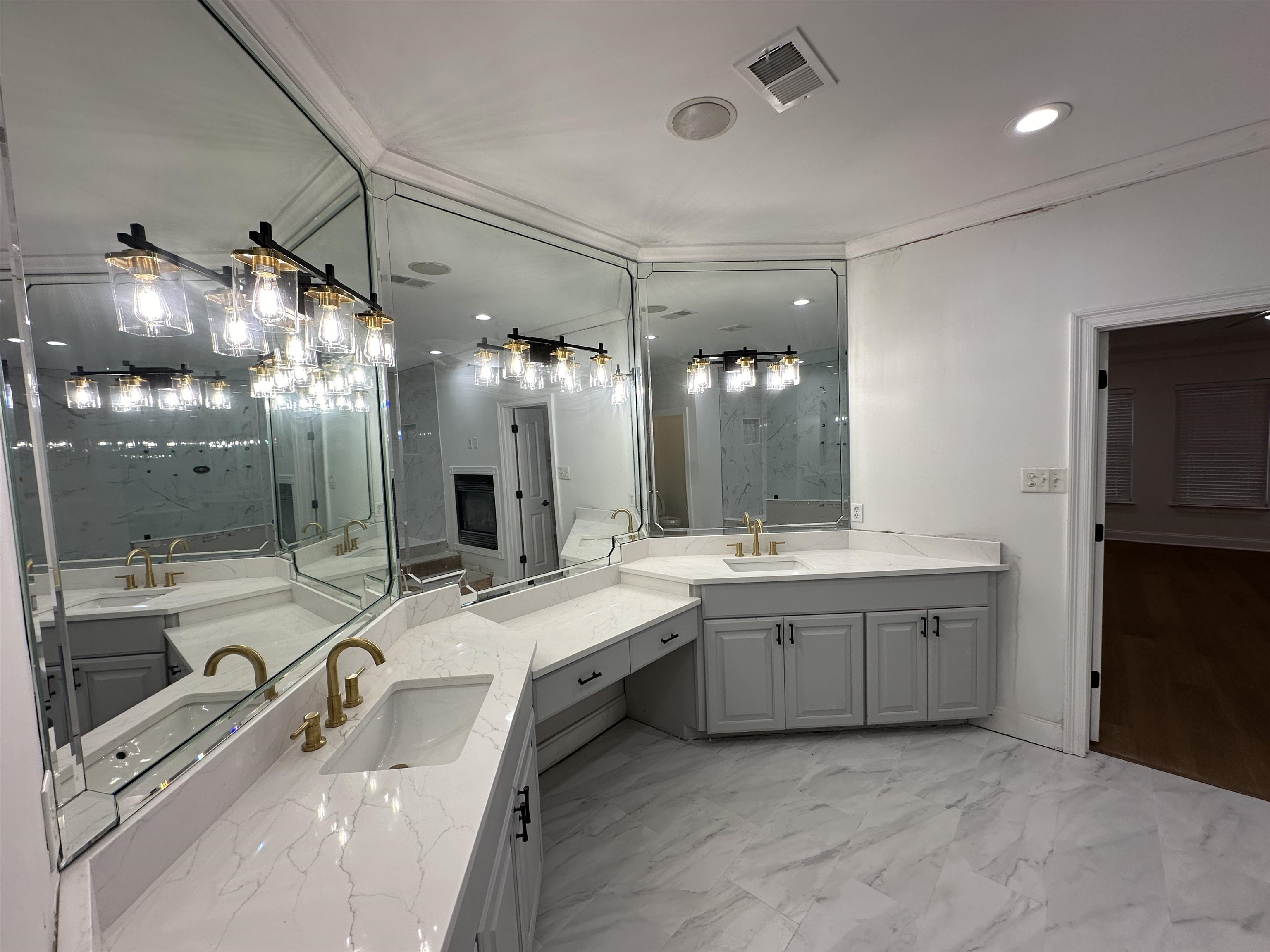 55 Hickory Nut Road Piperton, TN 38017 - Photo 11 of 40 Bathroom featuring a sink, visible vents, two vanities, and marble finish floor