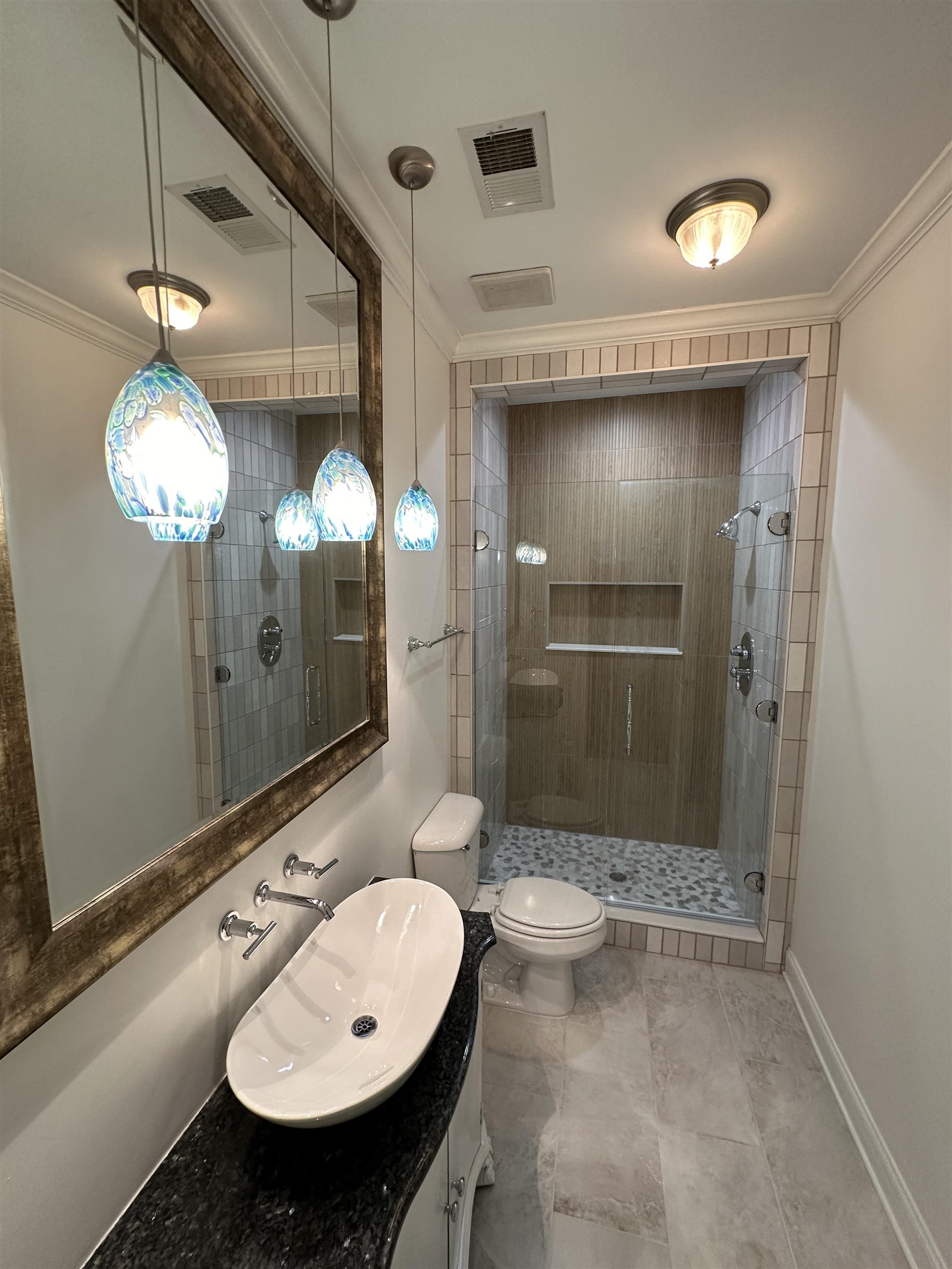 55 Hickory Nut Road Piperton, TN 38017 - Photo 23 of 40 Bathroom featuring visible vents, a shower stall, toilet, and ornamental molding