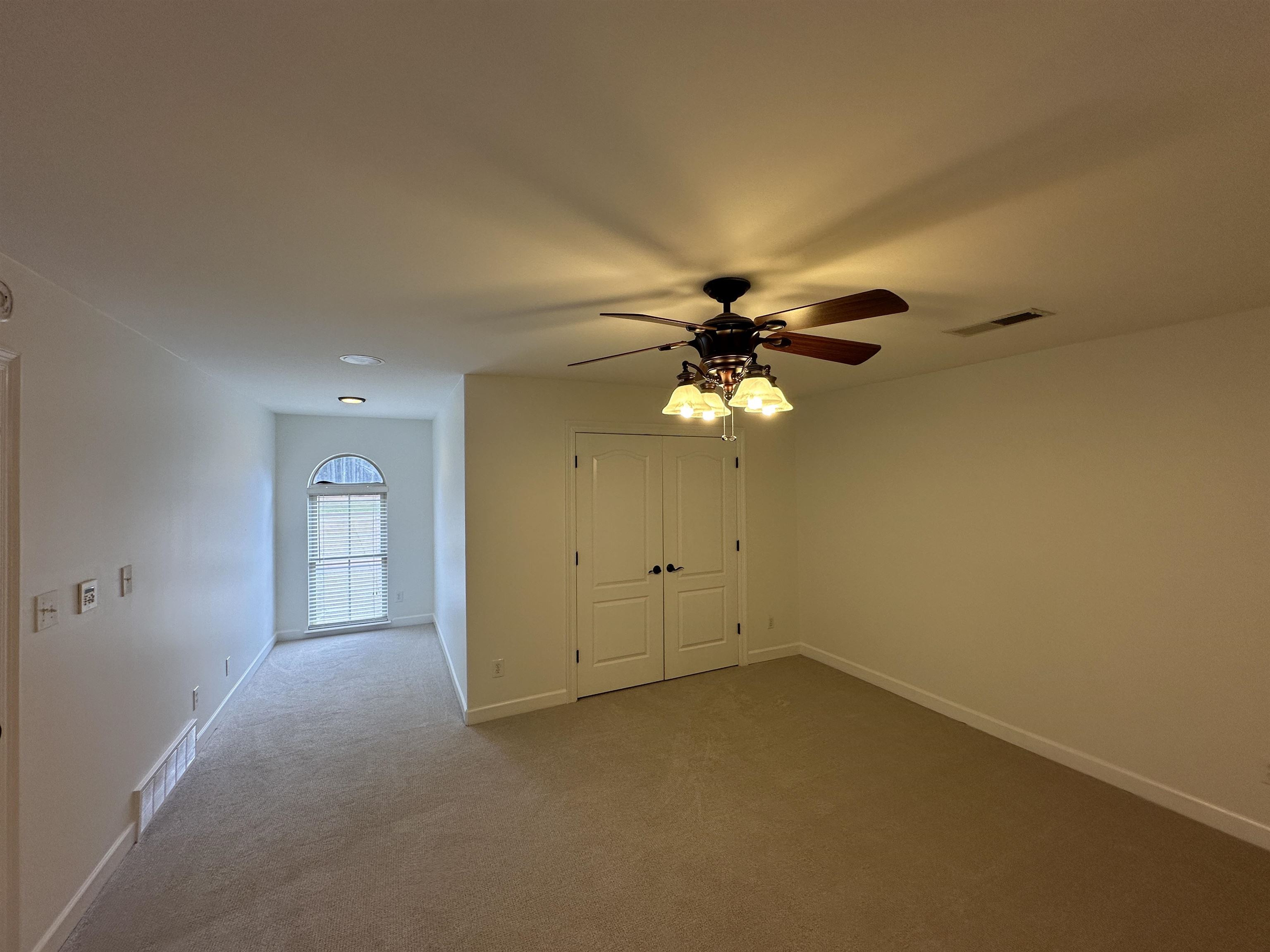 55 Hickory Nut Road Piperton, TN 38017 - Photo 24 of 40 Unfurnished room featuring visible vents, ceiling fan, baseboards, and carpet