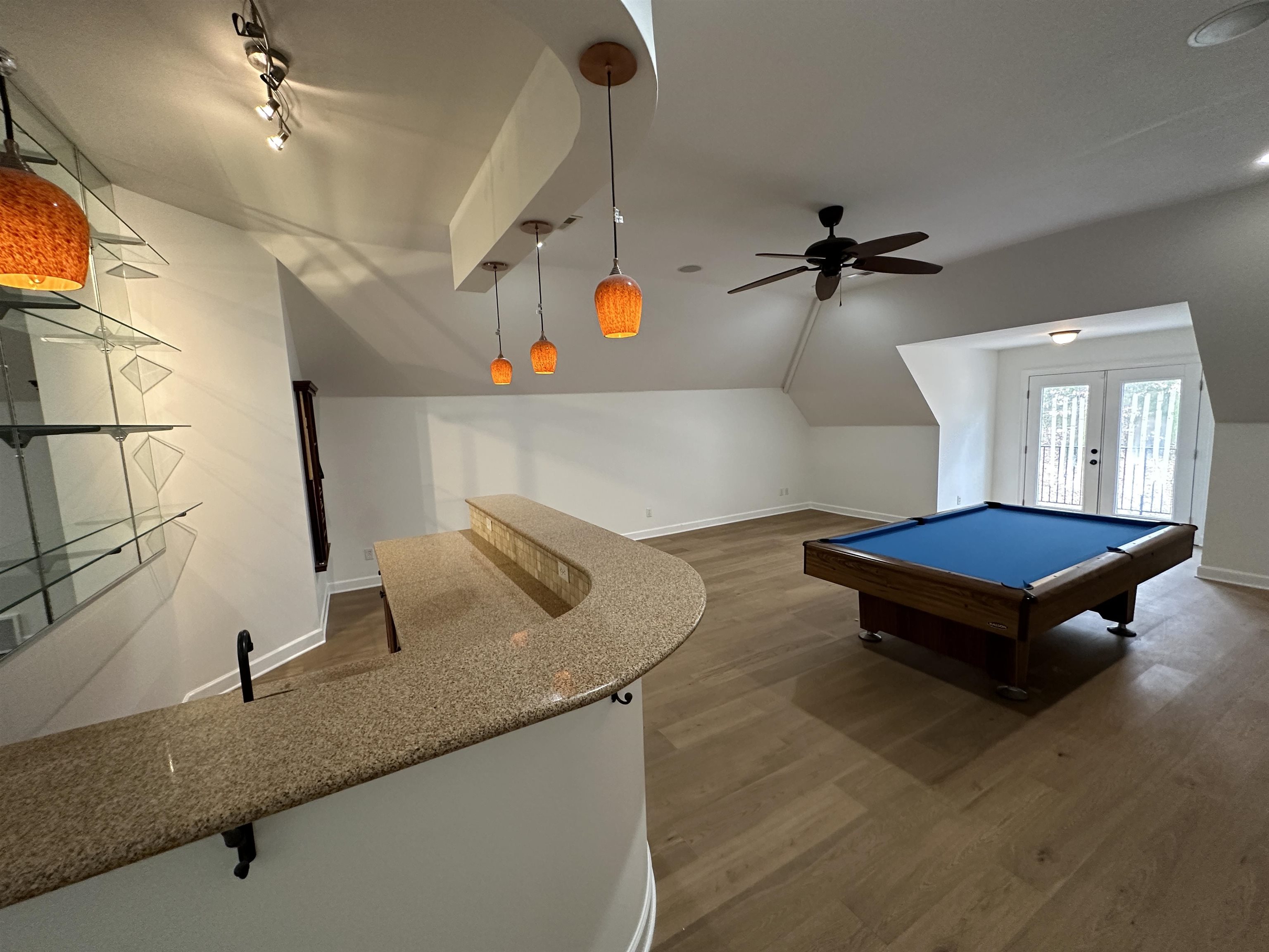 55 Hickory Nut Road Piperton, TN 38017 - Photo 32 of 40 Game room with wood finished floors, baseboards, vaulted ceiling, rail lighting, and french doors