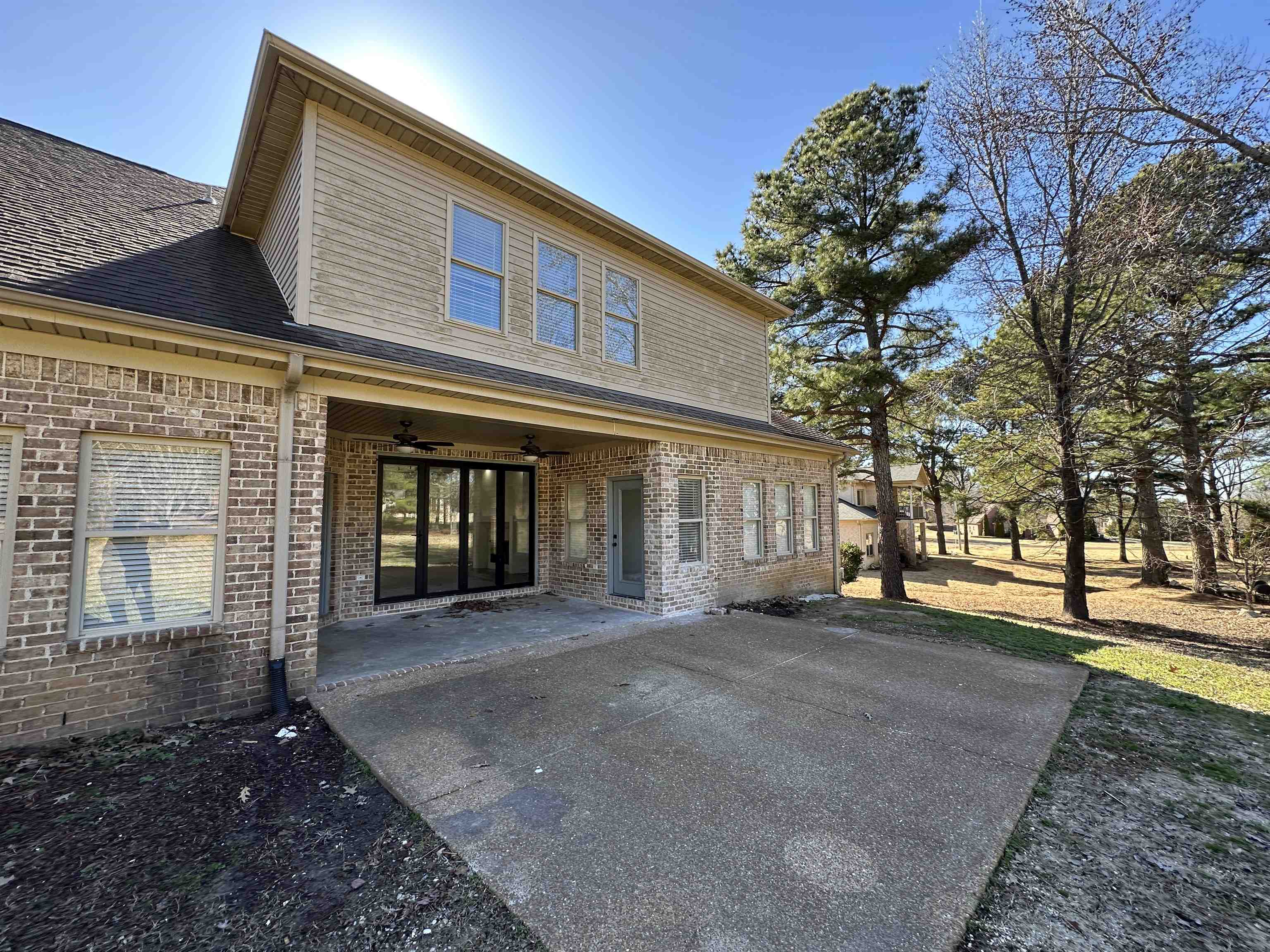 55 Hickory Nut Road Piperton, TN 38017 - Photo 39 of 40 Rear view of property featuring brick siding, roof with shingles, a ceiling fan, and a patio area
