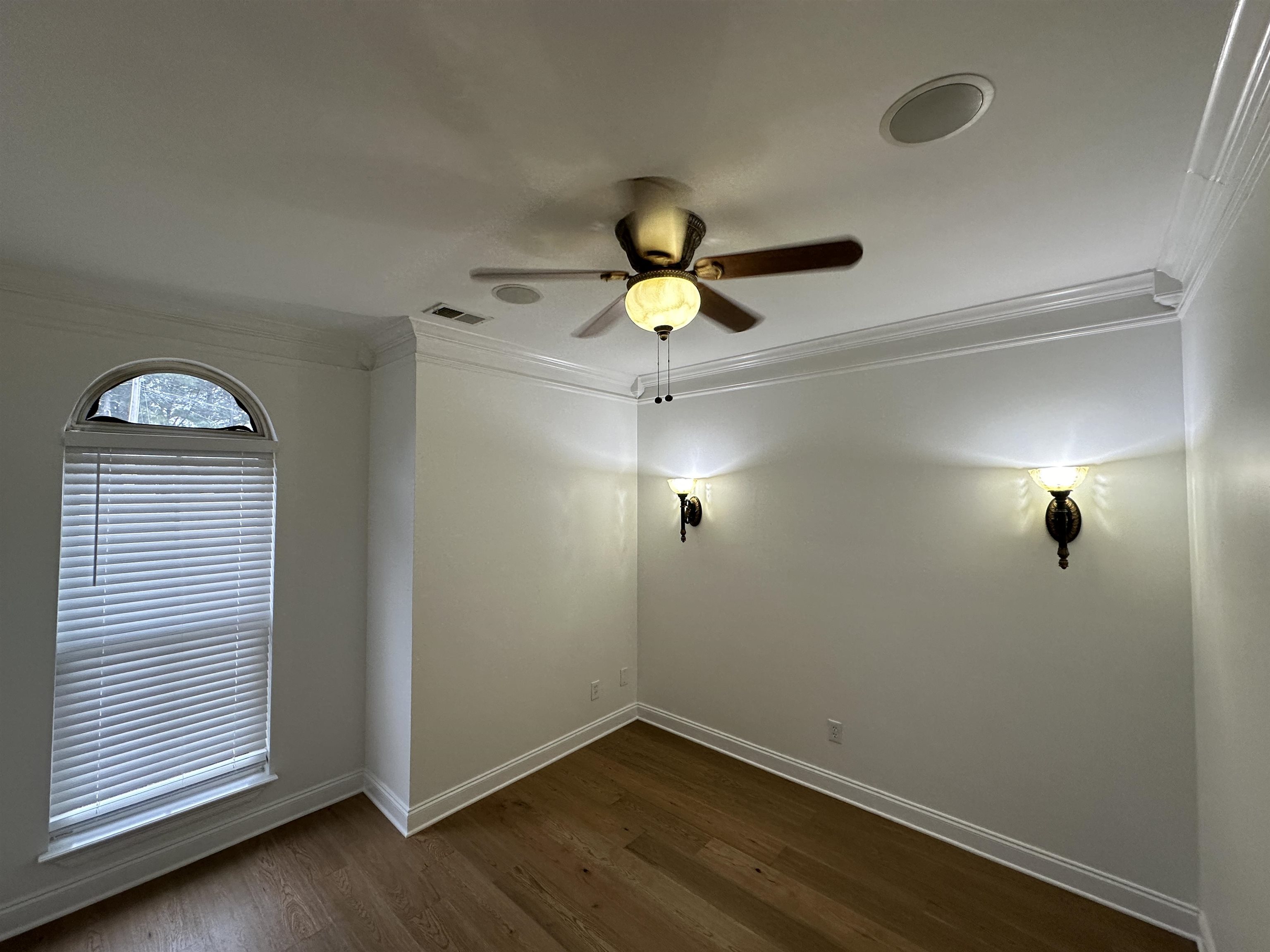 55 Hickory Nut Road Piperton, TN 38017 - Photo 5 of 40 Empty room featuring visible vents, dark wood-type flooring, baseboards, and ornamental molding