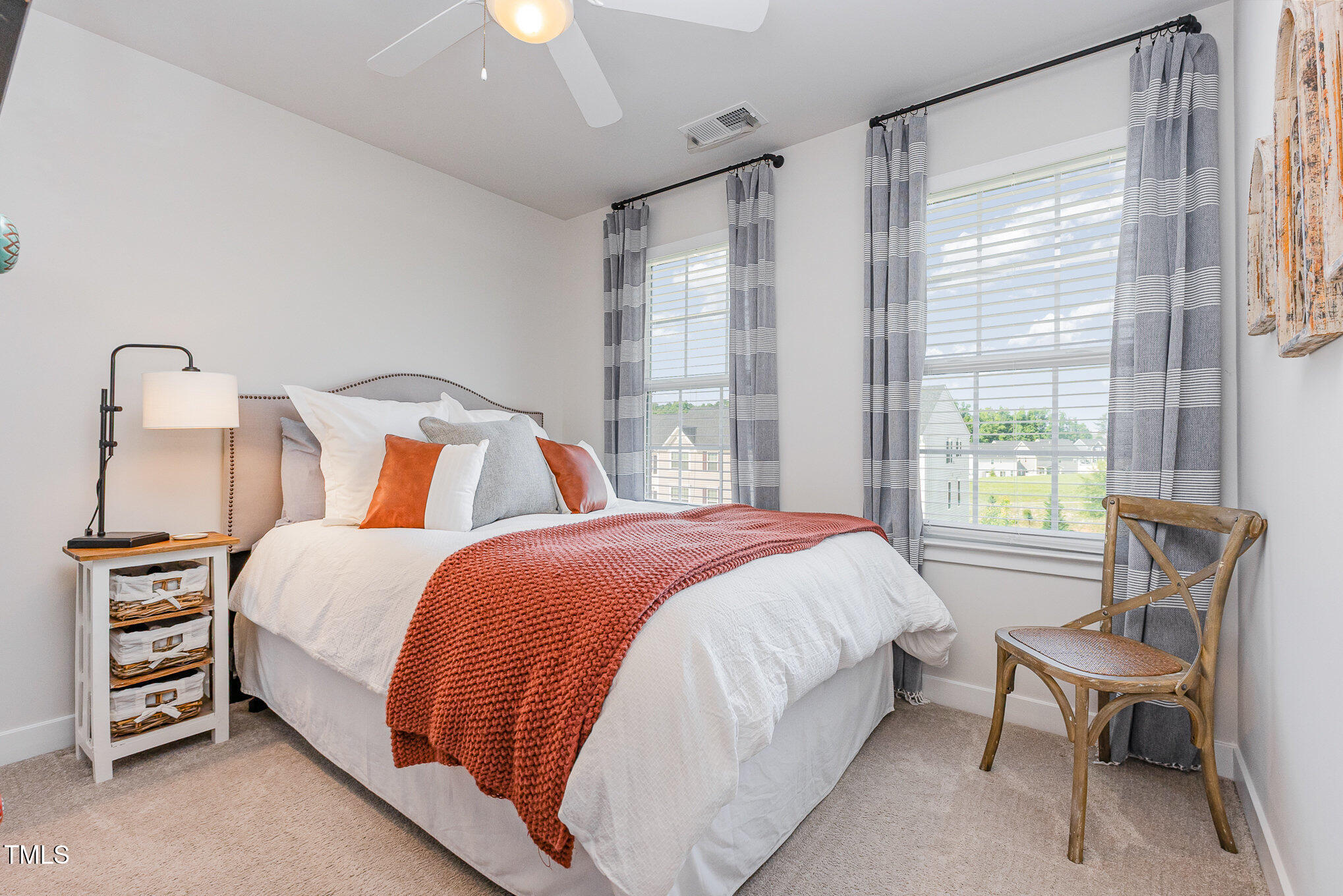 235 Misty Pike Drive Raleigh, NC 27603 - Photo 20 of 29 a bedroom with a bed and a window