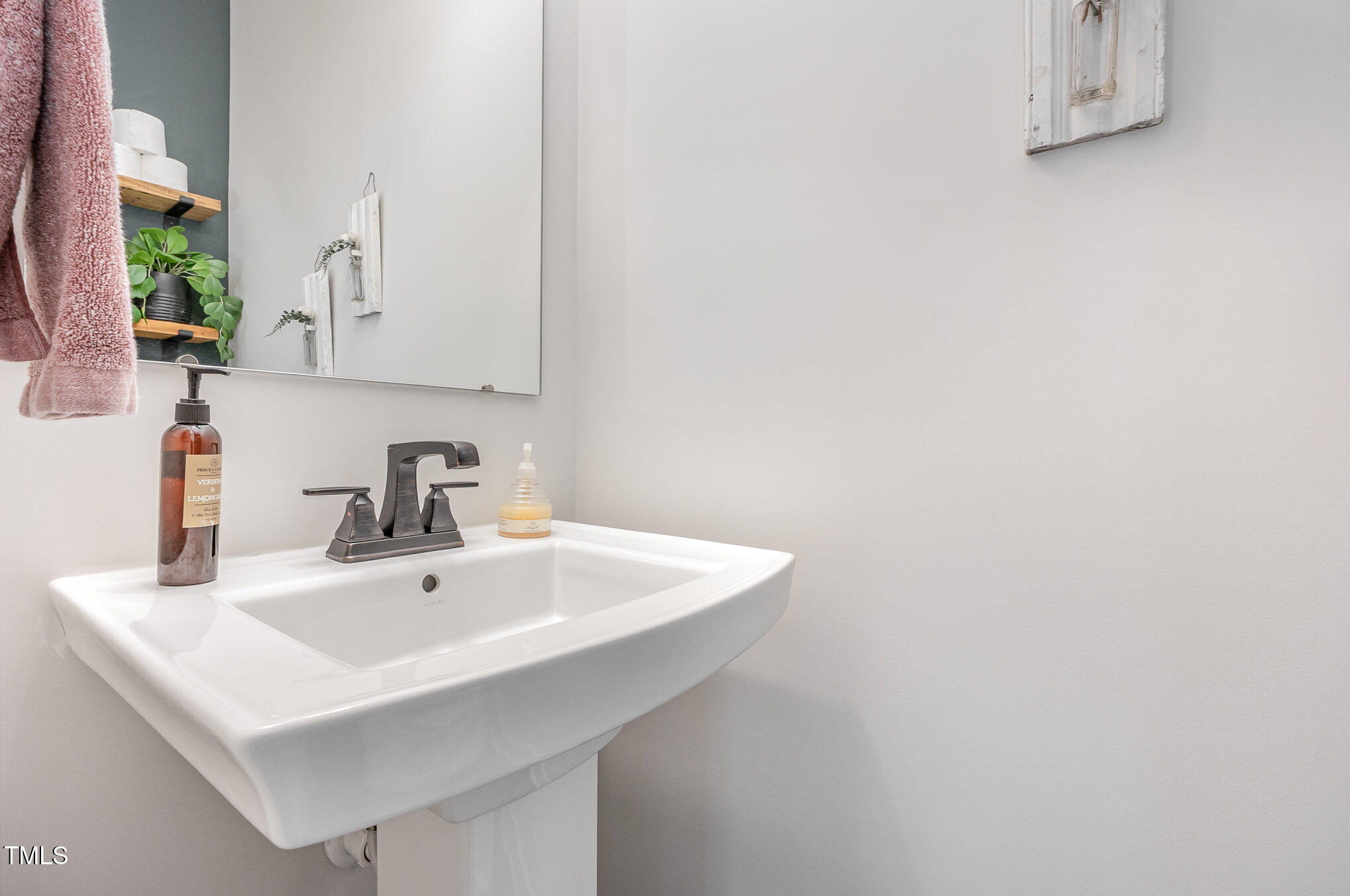 235 Misty Pike Drive Raleigh, NC 27603 - Photo 23 of 29 a white sink sitting next to a white sink